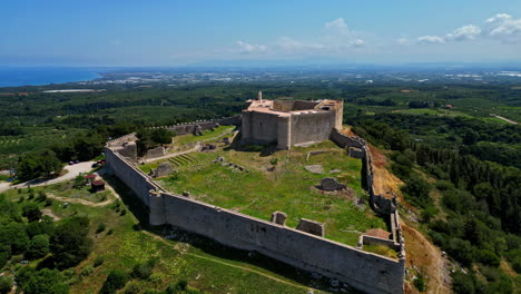 Aerial-view-around-the-Frankish-Castle-of-Chlemoutsi,-sunny-day-in-Kastro,-Greece