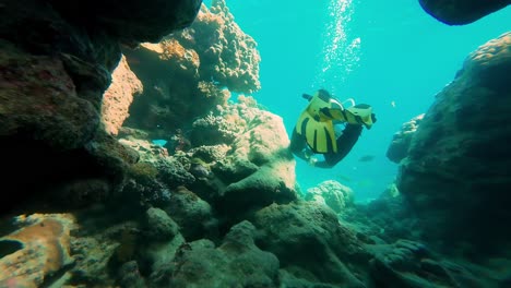 Diver's-perspective-at-Egypt-Dahab-swimming-between-cliffs-closeup-underwater