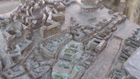 Close-up-of-a-bronze-scale-model-of-Würzburg,-highlighting-intricate-architectural-details