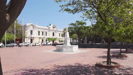 Establishing-shot-of-Bolivar-Park,-red-tiled-famous-square-in-Santa-Marta-City,-Colombia