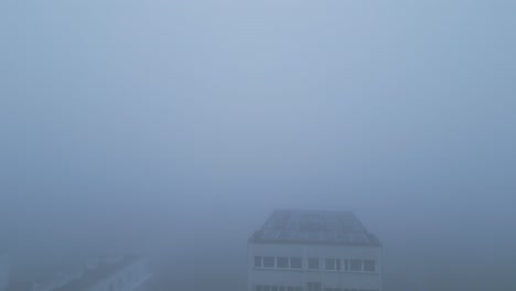 City-Buildings-In-Foggy-Morning-In-Poland---Drone-Shot