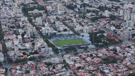 Aerial-Push-Over-Capital-City-Of-Salta-View-Of-Cars-Passing-Football-Stadium-Estadio-el-Gigante-del-Norte