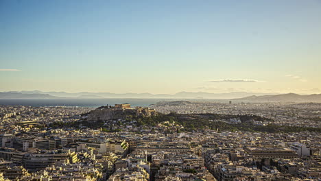 Timelapse-of-Acropolis-of-Athens,-Greece,-with-the-Parthenon-Temple-on-top-of-the-hill-in-distance