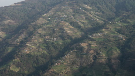 A-panning-view-of-the-terraced-hills-in-Nepal-with-houses-scattered-over-the-hills