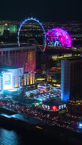 Vertical-4k-Timelapse,-Las-Vegas-Strip-at-Night,-Sphere,-High-Roller-Ferris-Wheel-and-Flashy-Lights