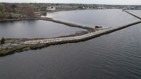 Construction-of-a-safe-harbor-with-the-dikes-in-the-water-in-Warwick,-Rhode-Island