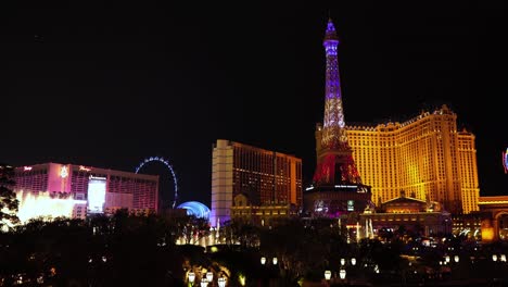 Las-Vegas-USA-at-Night,-Bellagio-Music-Fountain,-Paris-and-Flamingo-Casino-Hotels,-City-Lights