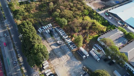 Trucks-Parked-On-Roadside-Near-Development-Site-In-Las-Piñas,-Metro-Manila,-Philippines