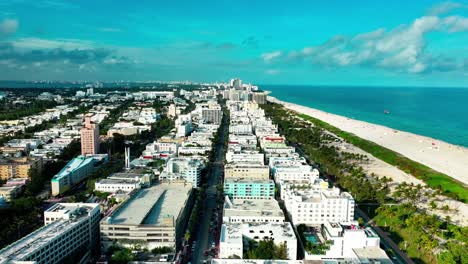 Flying-over-Ocean-Dr-in-Miami-South-Beach-on-a-cloudy-day-at-dusk-aerial-view