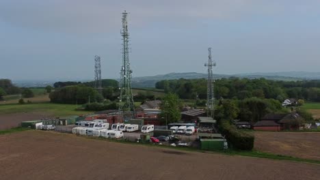 Billinge-hill-transmitter-antenna-towers-circling-aerial-view-caravan-storage-on-top-of-Crank-landmark-overlooking-St-Helens-countryside