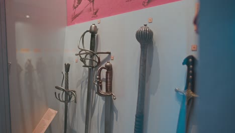 Collection-of-antique-swords-on-display-in-the-weapon-room-of-Trakošćan-Castle,-Croatia