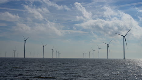 Windturbine-field,-lockshot,-in-Lake-IJssel-of-the-Netherlands,-Europe