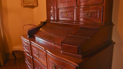 Intricately-carved-antique-bureau-in-the-Rococo-Room-at-Trakoscan-Castle,-Croatia