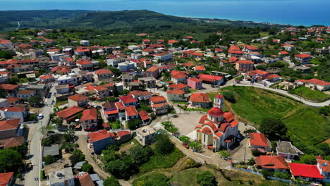 Aerial-View-of-Kastro-Kyllini-Municipality,-Elis,-West-Greece,-Orthodox-Church-and-Homes,-Drone-Shot