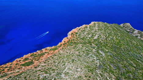 Boat-cruising-in-the-blue-waters-of-the-ionian-sea-close-to-Navagio-beach