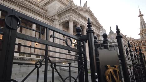 Ornate-gate-of-the-National-Congress-of-Argentina,-Buenos-Aires,-showcasing-detailed-ironwork-and-urban-background