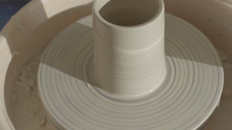 a-vase-spinning-on-the-pottery-wheel