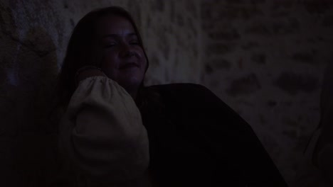 Slow-motion-shot-of-a-woman-sitting-in-a-dark-corner-of-a-wedding-reception