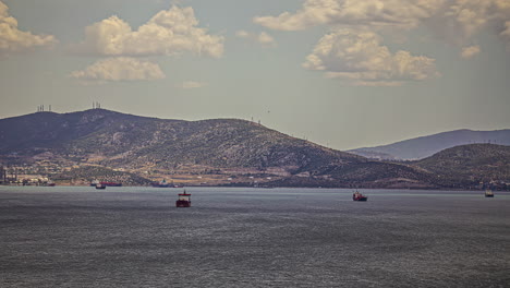 Time-lapse-of-moored-industrial-ships-on-the-coast-of-mainland-Greece,-sunny-day