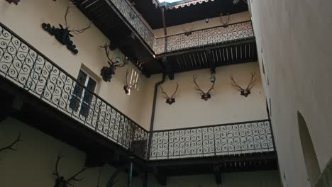 Decorated-balconies-and-antler-mounts-in-the-courtyard-of-Trakošćan-Castle,-Croatia