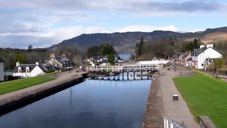 Scenic-landscape-view-of-Fort-Augustus-settlement-with-Caledonian-Canal,-locks-and-Loch-Ness-in-the-distance,-highlands-of-Scotland-UK