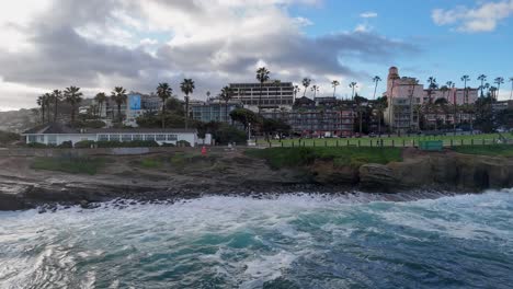 La-Jolla-Cove-Drone-Fly-Towards-the-shore-from-Ocean-as-waves-crash-below