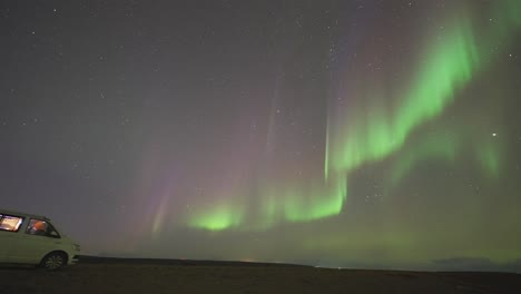 Mesmerizing-show-of-northern-lights-in-the-dark-night-sky-above-the-sea