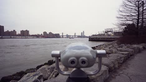 Standing-in-front-of-public-binoculars-next-to-Brooklyn-shoreline