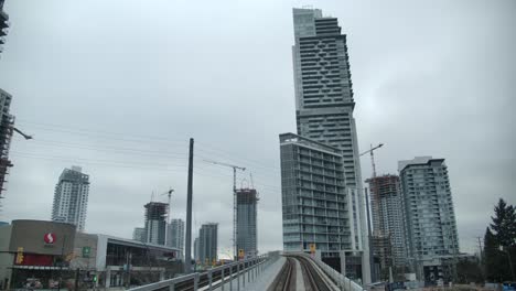 Tall-Structures-View-From-An-Elevated-Railway-In-The-City-Of-Vancouver,-British-Columbia,-Canada