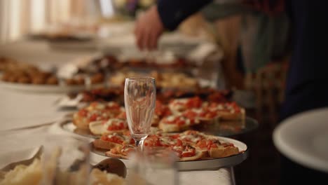 People-taking-slices-of-pizza-from-the-italian-wedding-buffet