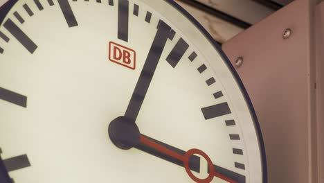 Close-up-of-a-Deutsche-Bahn-station-clock-showing-detailed-time