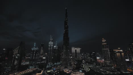 Dubai-downtown-skyline-at-blue-hour-with-world's-tallest-buildings-in-the-night-lighting_Aerial-view