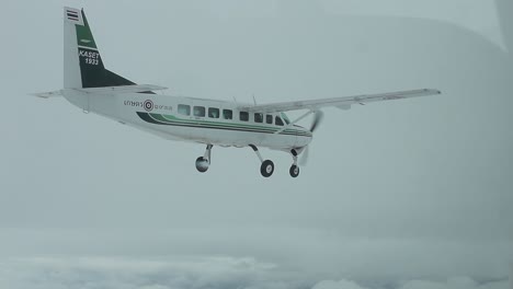 Small-Plane-Flying,-Cloudy-Day,-Editorial