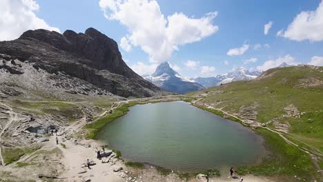 Beautiful-view-of-Matterhorn-over-the-Riffelsee-lake-with-the-reflection-and-clouds-in-Swiss-Alps,-Switzerland,-Europe