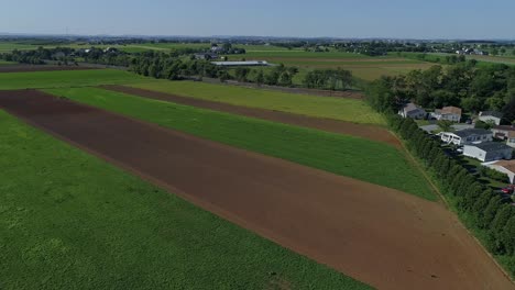 An-Aerial-View-of-a-Patch-Work-of-Farmlands-Next-to-a-Mobile-Home-Park-on-a-Sunny-Day