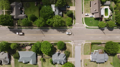 Overhead-View-Of-Cars-Driving-In-The-Road-Along-The-Houses-In-Collierville-Town-in-Tennessee