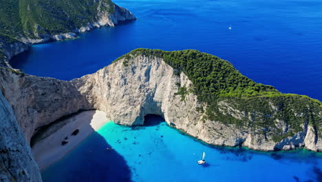 Aerial-view-overlooking-the-Navagio-shipwreck-Beach,-in-sunny-Zakynthos,-Greece