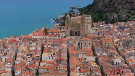 Amazing-Establishing-Drone-Shot-Above-Cefalu-Cathedral-in-Sicily,-Italy
