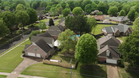 Suburban-neighborhood-in-collierville,-tennessee,-showcasing-lush-greenery-and-family-homes,-aerial-view