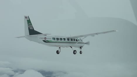 Small-Plane-Flying,-Cloudy-Day,-Editorial
