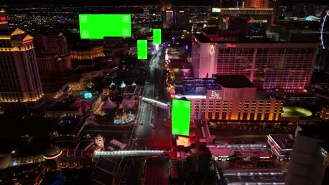 Green-screen-banners-tracked-on-billboards,-in-illuminated-Las-Vegas,-USA