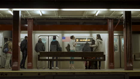 Commuters-Wait-as-Subway-Train-Arrives-at-34th-Street-Station-in-NYC