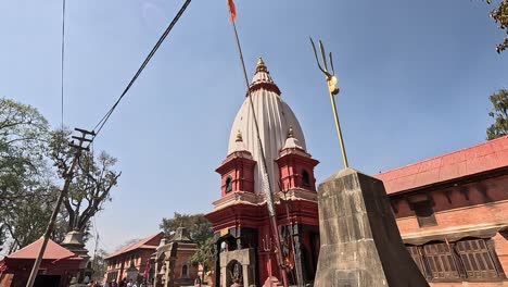 Shiva-Trident-and-Temple-of-Mrigasthali-against-blue-sky