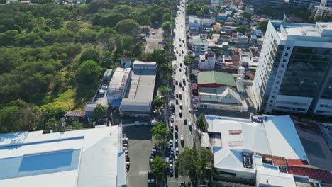 City-Traffic-Road-In-Alabang,-Las-Piñas,-Metro-Manila,-Philippines---Aerial-Drone-Shot