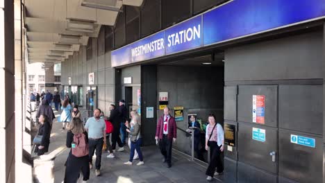 Crowd-of-people-entering-and-exiting-Westminster-Station-in-London-during-daylight