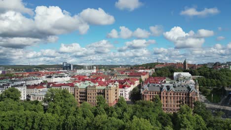 Sunny-city-aerial-rises-over-Gothenburg-Sweden-with-skyline-buildings