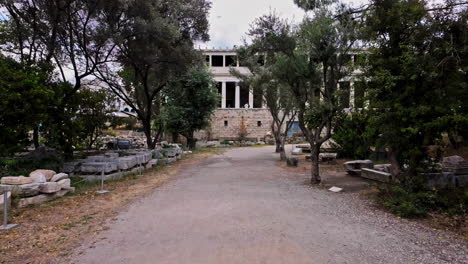 POV-shot-while-walking-towards-museum-of-Stoa-of-Attalos,-Ancient-Agora-in-Athens,-Greece-at-daytime