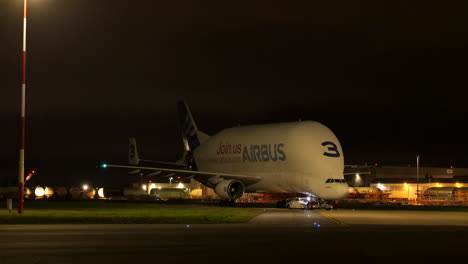 Pushback-truck-pushing-Airbus-Beluga-at-airport