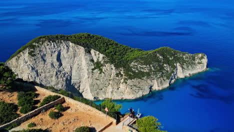 Revealing-aerial-view-of-Navagio-beach-with-the-famous-wrecked-ship-in-Zante,-Greece