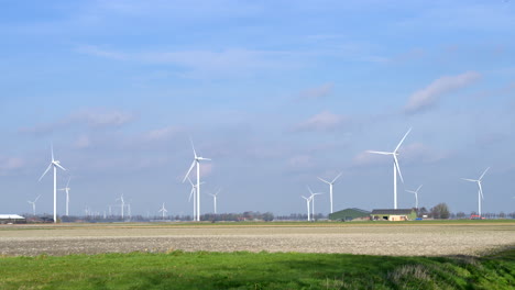 Windturbines-in-an-agricultural-field-in-the-Netherlands,-Europe